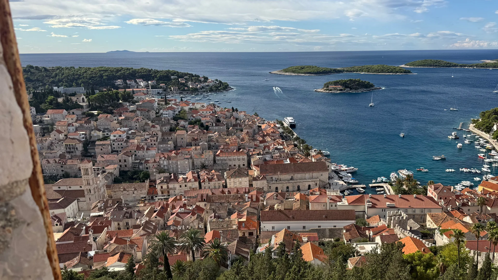Aerial view of Hvar's old town, harbour and the wooded Pakleni Islands across the bay